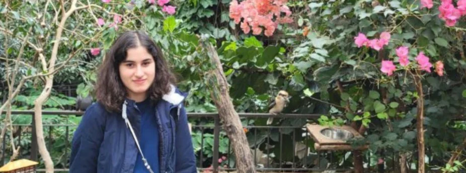 Dorsa standing in a garden